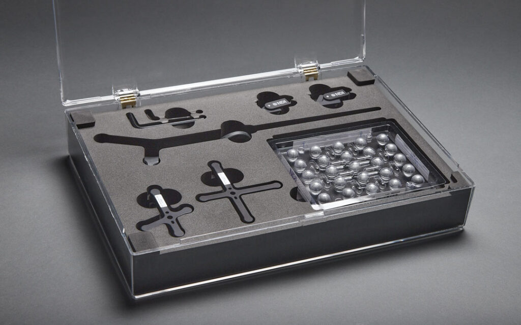 Polaris Tool Starter Kit including a probe, two rigid bodies, two rigid body clamps, and twenty-five markers in a storage case.