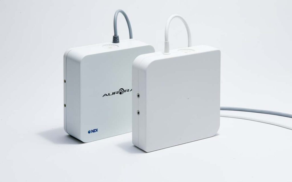 Aurora Planar 20-20 V2 and X2 side by side with attached cables, one displaying the Aurora and NDI logos on the front face.