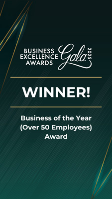 Business Excellence Awards Gala 2025 winner graphic announcing the Business of the Year (Over 50 Employees) Award, with gold accents on a dark green background.