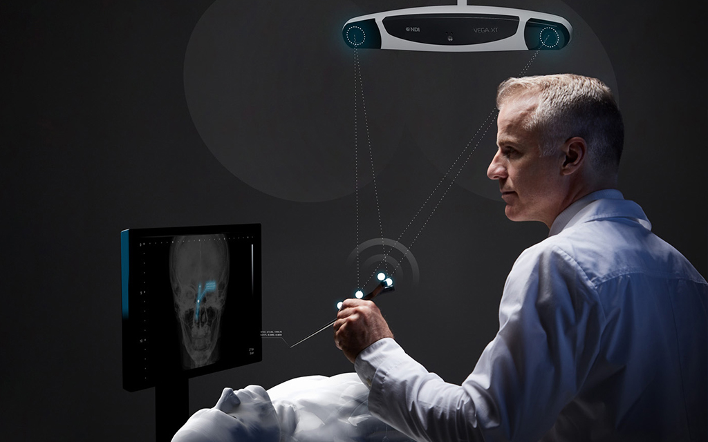 Surgeon using an optical tracking system during a cranial procedure